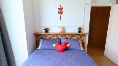 Standard bedroom with decorative elements and bed