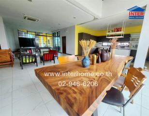 Modern kitchen and dining area with wooden table and chairs