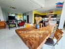 Modern kitchen and dining area with wooden table and chairs