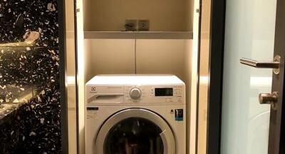 Compact laundry area with a washing machine