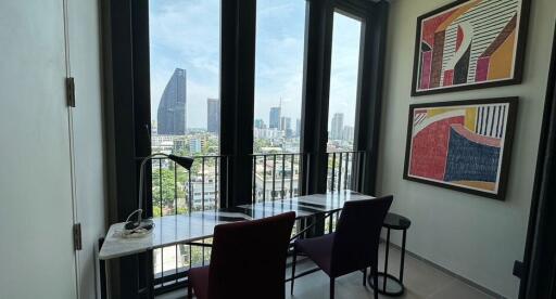 Modern living area with large windows and city view