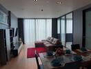 Modern living room with dining area and natural light