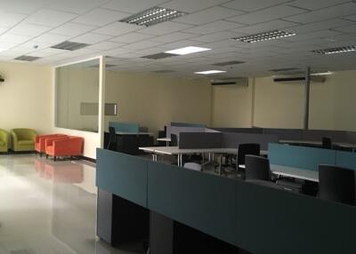 Spacious office area with desks and seating