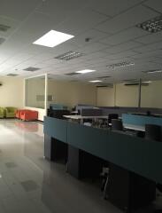 Spacious office area with desks and seating