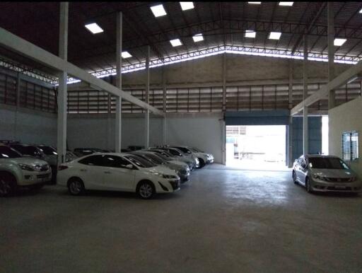 Spacious garage with multiple parked cars