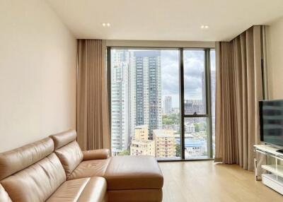 Modern living room with a large window offering city views