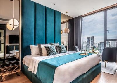 Modern bedroom with large floor-to-ceiling windows offering a city view