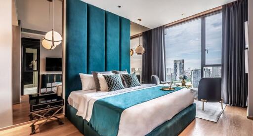 Modern bedroom with large floor-to-ceiling windows offering a city view