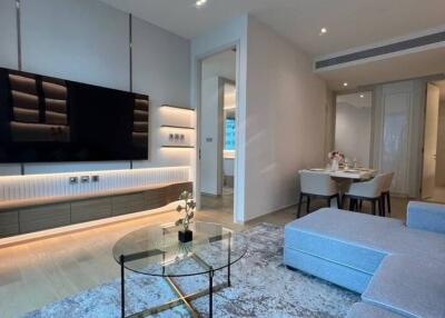 Modern living room with mounted TV and glass coffee table