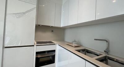 Modern kitchen with built-in appliances and white cabinetry