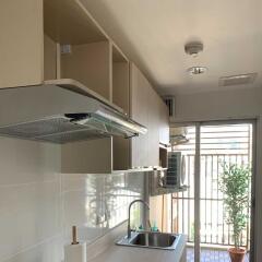 Modern kitchen with sink and storage cabinets