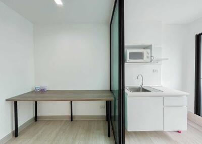 Modern, minimalist kitchen and dining area