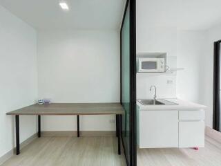 Modern, minimalist kitchen and dining area