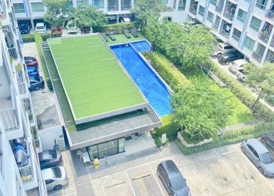 Ariel view of residential building with pool