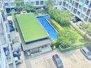 Ariel view of residential building with pool