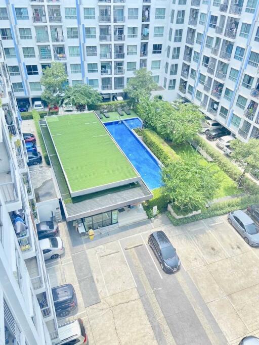 Ariel view of residential building with pool