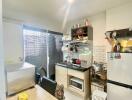 Compact kitchen with essential appliances and storage space