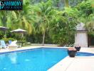 Outdoor swimming pool surrounded by palm trees and lounge chairs