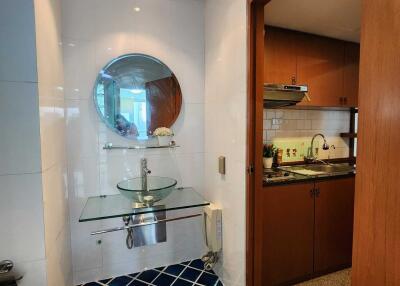 Small bathroom with modern glass sink and mirror