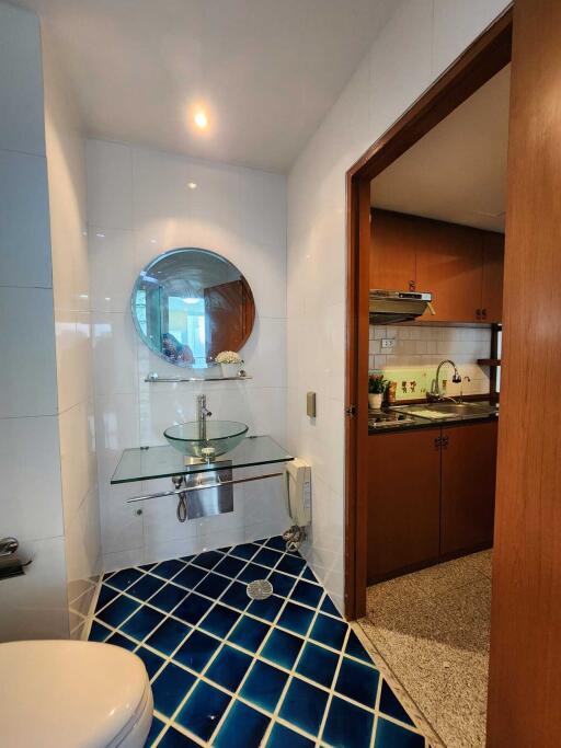 Small bathroom with modern glass sink and mirror