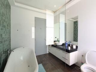 Modern bathroom with bathtub and mirror