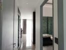 Modern hallway leading to other rooms with a view of bright natural lighting