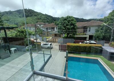 View of the residential area from the balcony with swimming pool