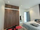 Modern bedroom with large wardrobe and cozy decor
