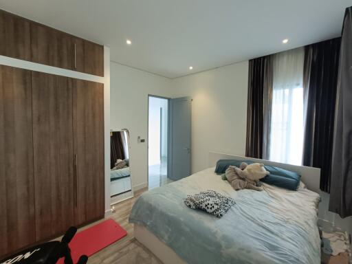 Modern bedroom with a large wardrobe and a bed