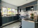 modern kitchen with island and large window