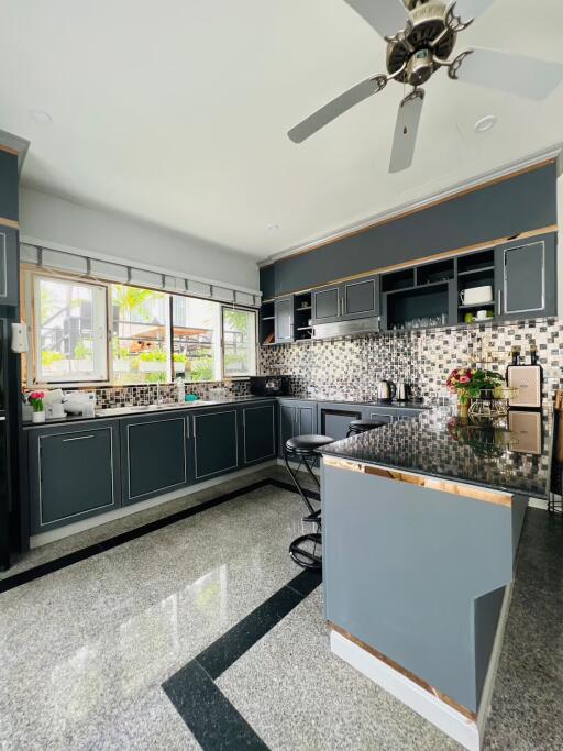 modern kitchen with island and large window