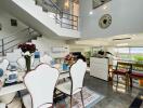 Spacious dining area with modern furniture and elegant decor in a multi-level home