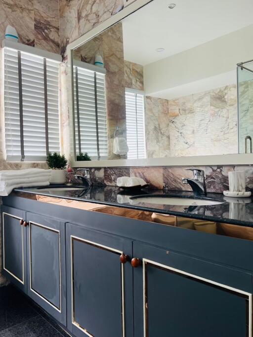 Modern bathroom with double sink and large mirror