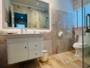 Modern bathroom with illuminated mirror and glass shower