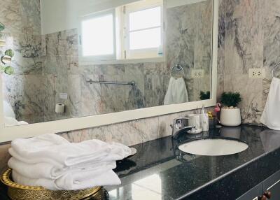 Bathroom with large mirror and modern sink