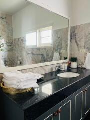 Bathroom with large mirror and modern sink