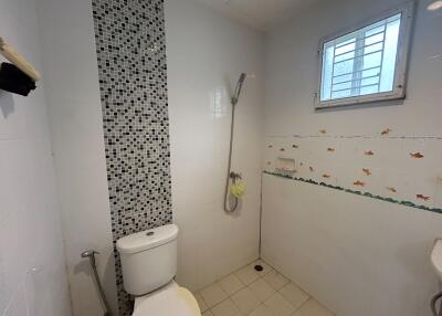 Simple bathroom with shower and toilet