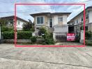 Exterior view of a two-story house for sale