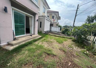 Backyard view of the building with sliding glass door