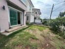 Backyard view of the building with sliding glass door