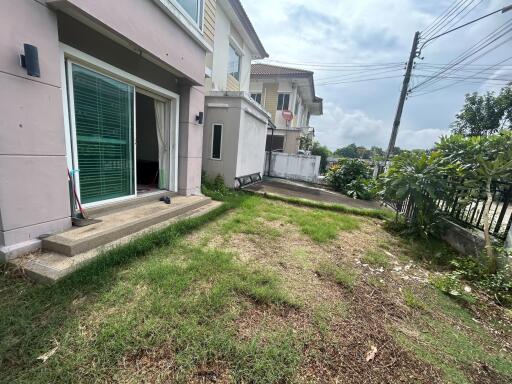 Backyard view of the building with sliding glass door