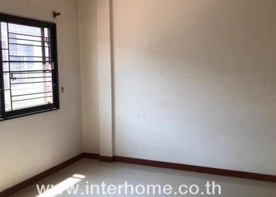 empty bedroom with window and branded watermark