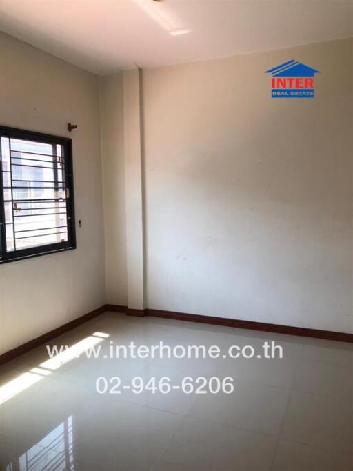 empty bedroom with window and branded watermark