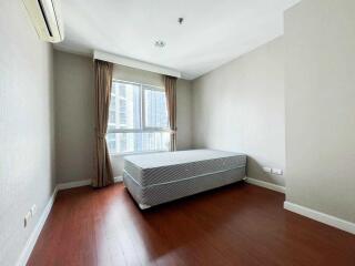 Spacious bedroom with large window