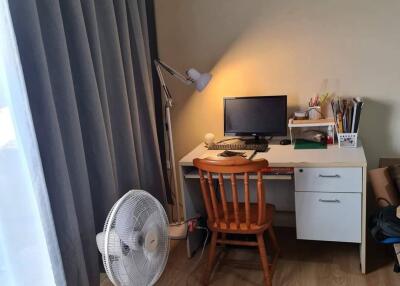 Bedroom with work desk and wooden chair