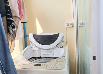 Small laundry area with a washing machine