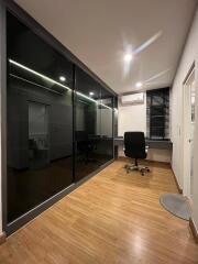 Modern home office with black sliding door closets