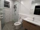 Modern bathroom with glass-enclosed shower and mounted sink