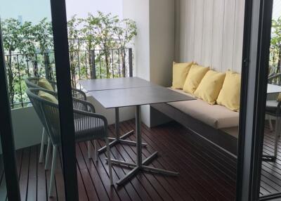 Balcony with seating area and table