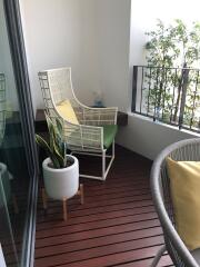 Cozy balcony with modern furniture and plants